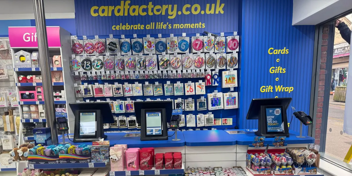 Automated energy management - A modern office building with tan brick and glass windows features a central courtyard. A faint double rainbow appears in the sky above the building. Automated energy management - A modern office building with tan brick and glass windows features a central courtyard. A faint double rainbow appears in the sky above the building.